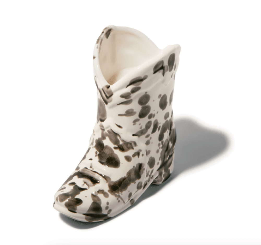 170 gram Palo Santo Suade scented candle in ceramic cowboy boot shaped vase with black speckled pattern